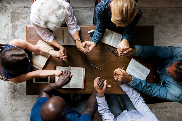 Diverse people praying