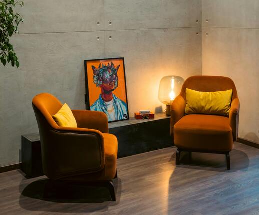 Modern living room chairs and decor setup, ideal items to sell on Facebook Marketplace.