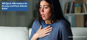 Woman experiencing anxiety, clutching her chest with a distressed expression while sitting on a couch.