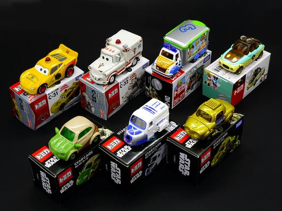 Collection of toy cars displayed on boxes, suitable items to sell on Facebook Marketplace.