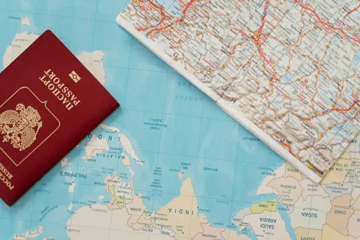 Passport and map representing the journey and paperwork challenges caused by EU Visa-Free Travel Changes affecting cross-border dating and immigration.