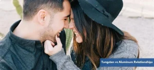 Smiling couple touching foreheads, showing emotional connection in a lasting relationship.