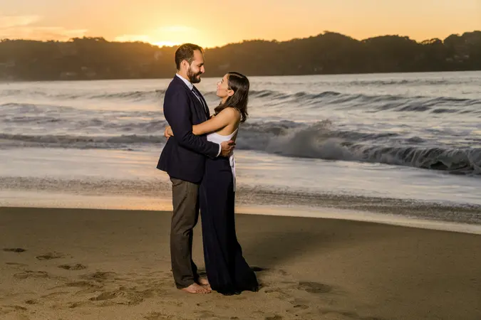 Couple embracing on the beach at sunset, symbolizing emotional connection when meeting potential partners who align with your values.