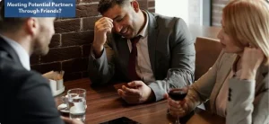 A man looking stressed during a group meetup — a possible awkward moment while meeting potential partners through friends