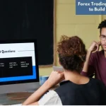 A group of beginner forex traders discussing essential trading questions around a desktop screen during a learning session